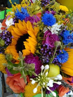 Summer wedding bouquet with yellows, pinks and blues